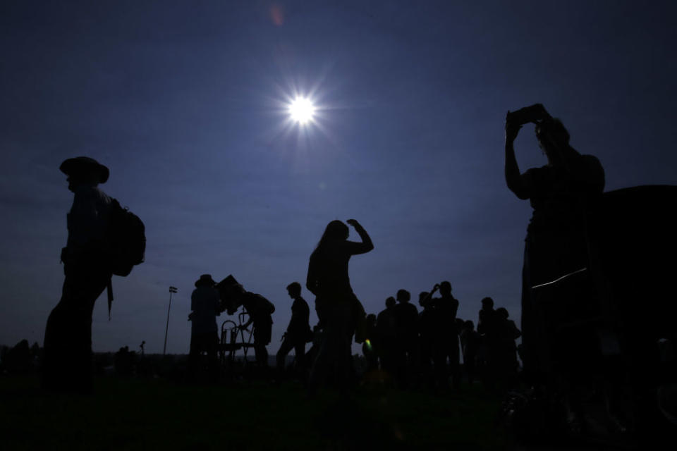 people gather to watch a solar eclipse.