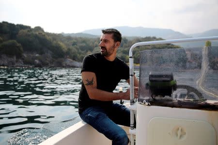 Greek fisherman Stratis Valamios, 40, a Nobel Peace Prize nominee, is seen onboard his motorboat at the sea, near the Skala Sikamias village on the island of Lesbos, Greece, October 5, 2016. REUTERS/Alkis Konstantinidis