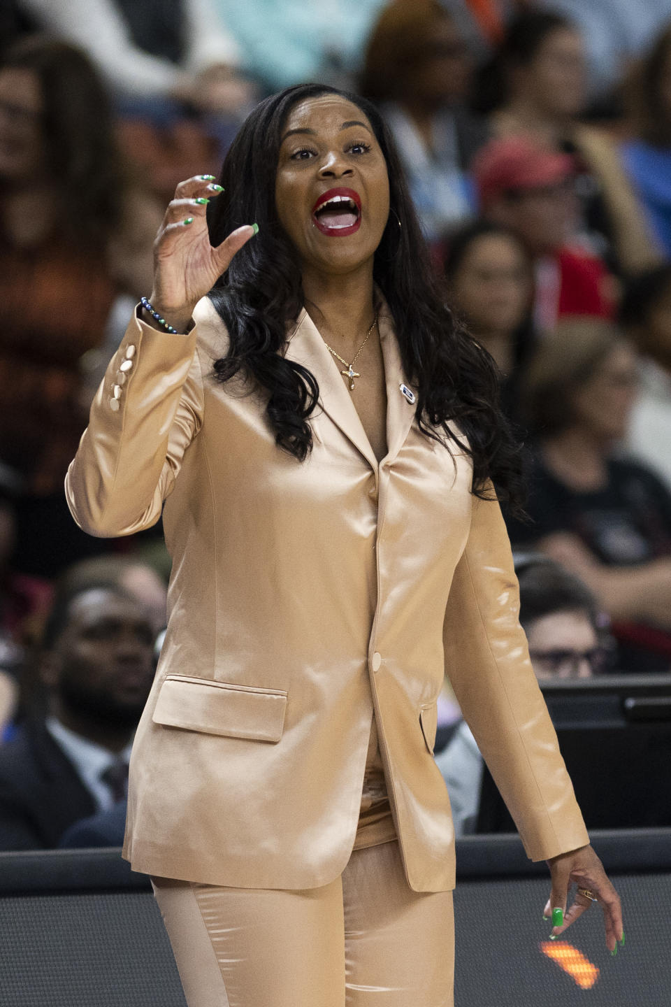 Notre Dame's head coach Niele Ivey talks to her players during the first half of a Sweet 16 college basketball game against Maryland in the NCAA Tournament in Greenville, S.C., Saturday, March 25, 2023. (AP Photo/Mic Smith)