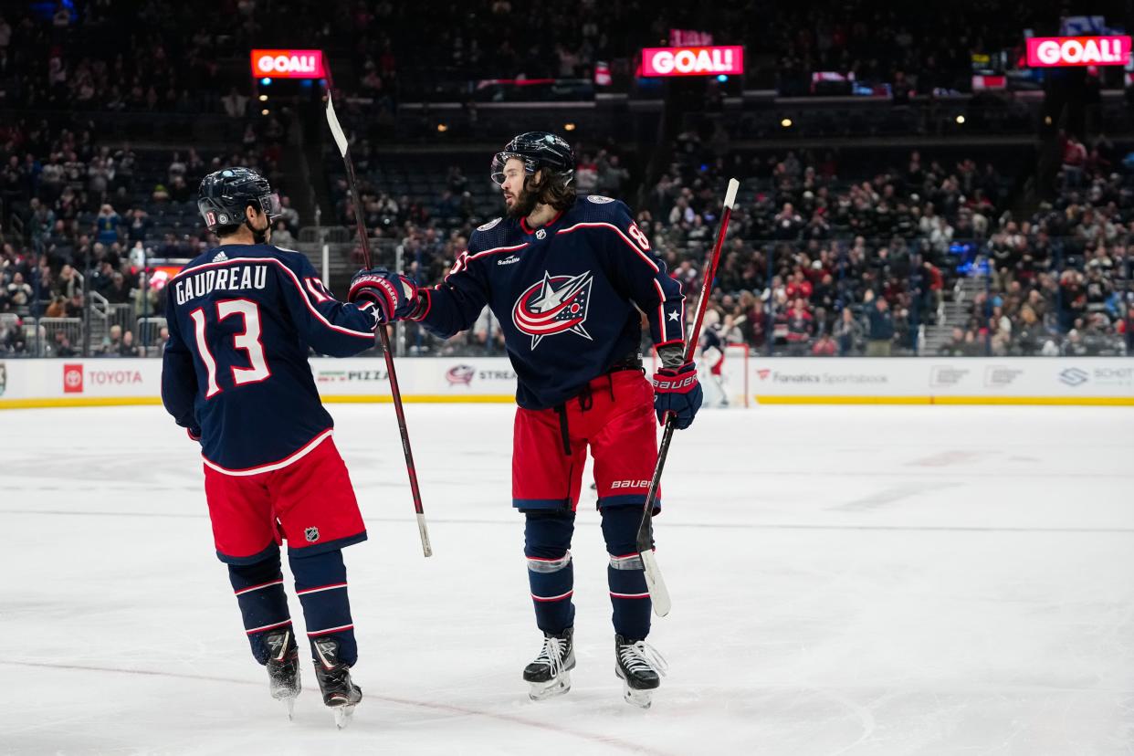 Dec 5, 2023; Columbus, Ohio, USA; Columbus Blue Jackets right wing Kirill Marchenko (86) celebrates scoring a goal with left wing Johnny Gaudreau (13) during the first period of the NHL game against the Los Angeles Kings at Nationwide Arena.