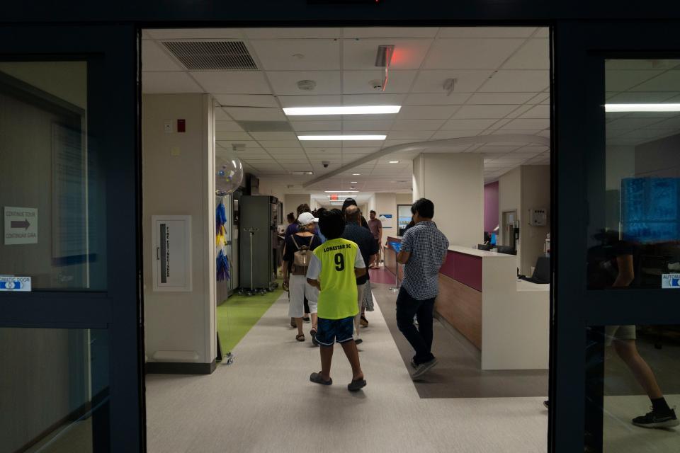 Visitors explore the first floor of Dell Children’s North Campus, which opened in April. Six more new hospitals are planned for Central Texas.