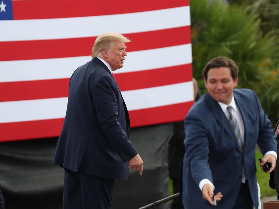 President Donald Trump exits from the stage after speaking about the environment during a stop at the Jupiter Inlet Lighthouse as Florida Governor Ron DeSantis hands out pens to people in the crowd on September 08, 2020 in Jupiter, Florida.