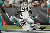 Miami Dolphins quarterback Tua Tagovailoa (1) is sacked by Cincinnati Bengals' Josh Tupou (68) during the first half of an NFL football game, Thursday, Sept. 29, 2022, in Cincinnati. (AP Photo/Joshua A. Bickel)