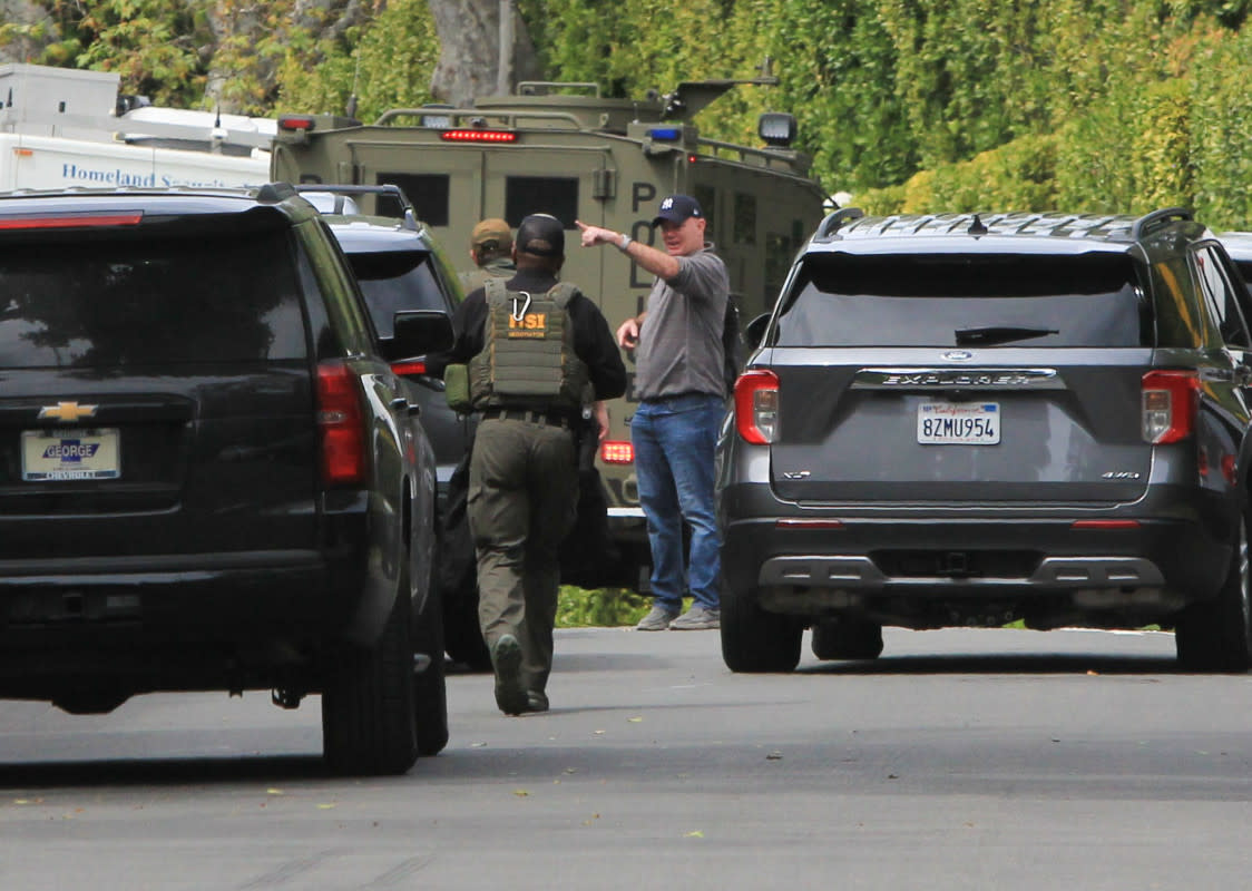 View of law enforcement agents and vehicles outside Diddy's Beverly Hills estate on March 25, 2024<p>HIGHFIVE/Bauer-Griffin/Getty Images</p>