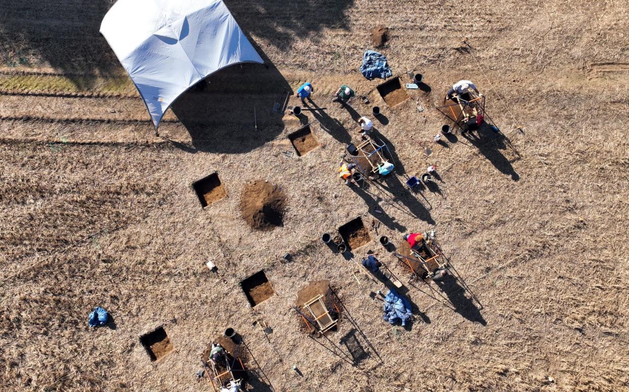 Archaeologists find items during excavation work at the site