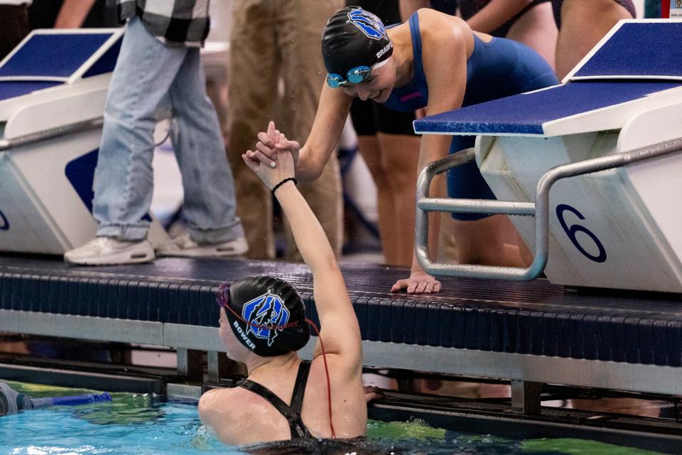 Students of Carbon High School celebrate after the women’s 200 medley relay at swimming preliminaries for state championships at BYU’s Richards Building in Provo on Friday, Feb. 16, 2024. | Marielle Scott, Deseret News