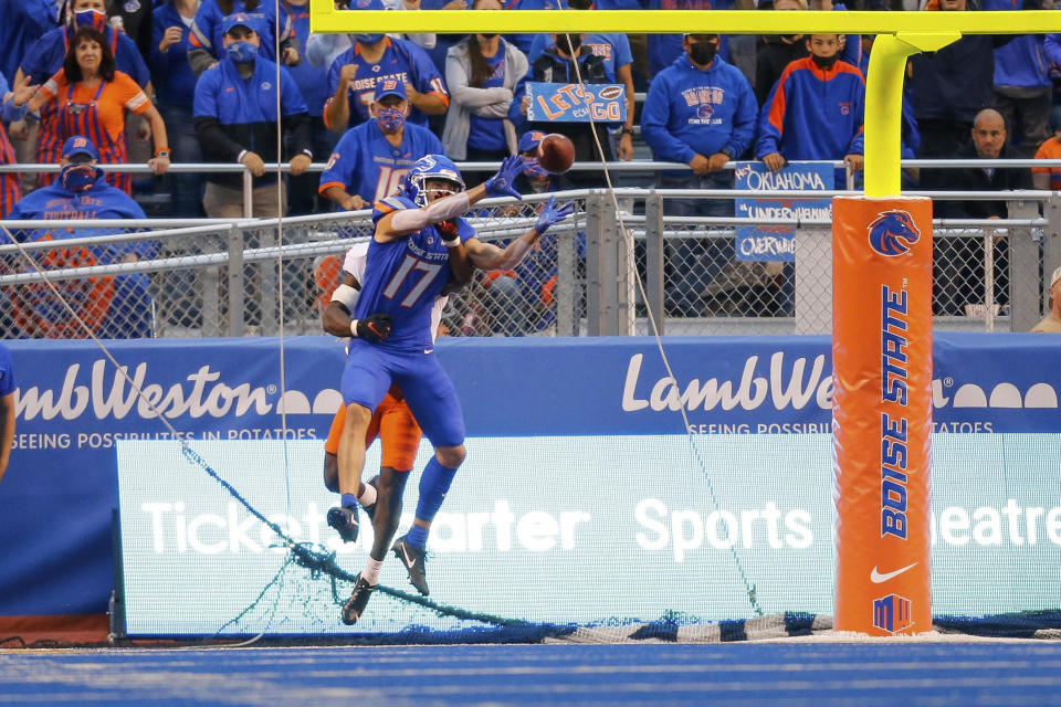 Boise State wide receiver Davis Koetter (17) reaches back for the ball on a touchdown reception against Oklahoma State during the first half of an NCAA college football game Saturday, Sept. 18, 2021, in Boise, Idaho. (AP Photo/Steve Conner)