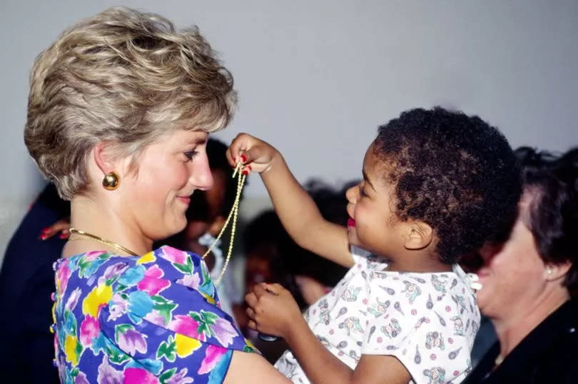 Princess Diana during a visit to a hostel for abandoned children in Sao Paulo, many of them HIV Positive or suffering from AIDS