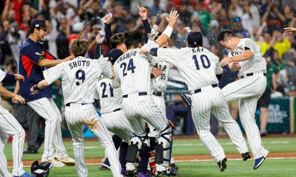 Team Japan celebrate after beating their Mexican rivals in Miami