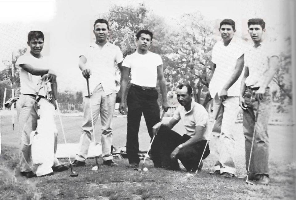 San Felipe Superintendent JB Peña, kneeling, stands with the Mexican American high school golf team he recruited from country club caddies (Bertha Peña)