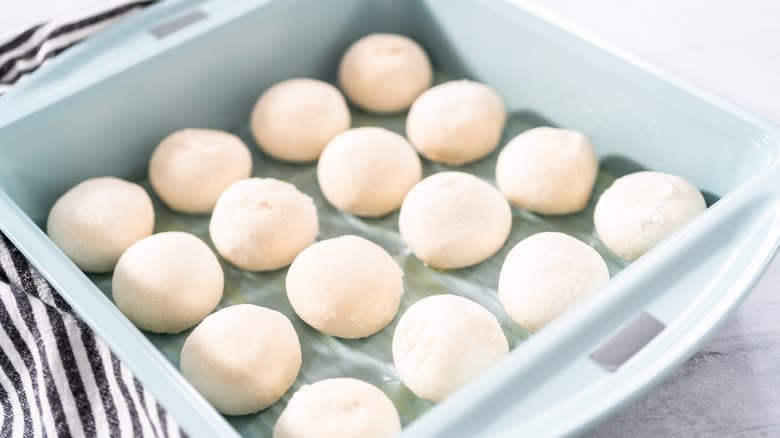 Frozen dinner rolls in a baking dish