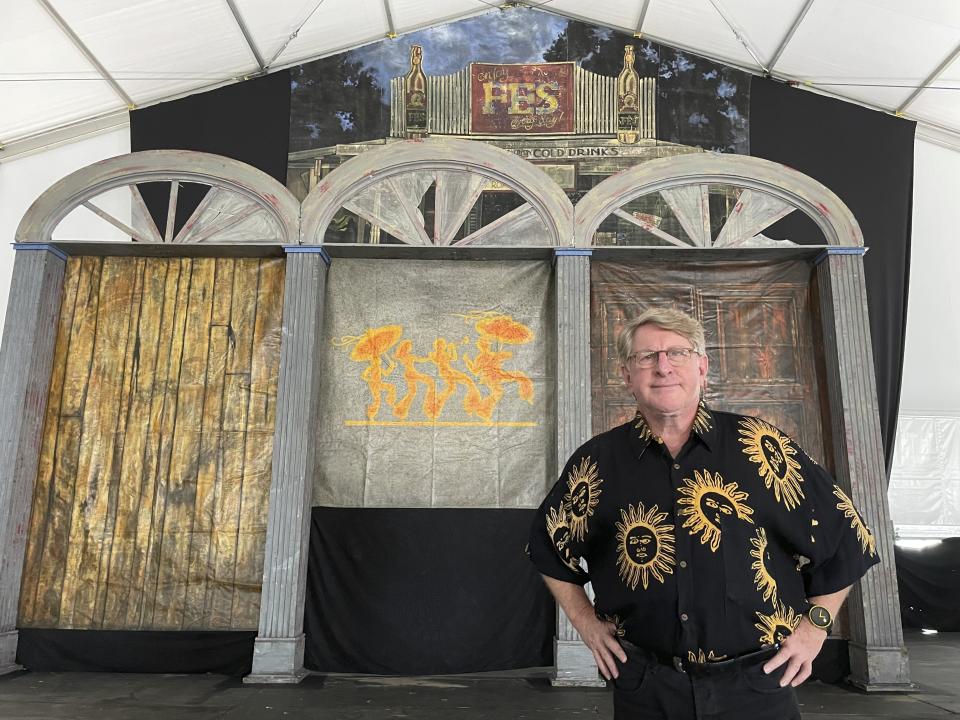 Quint Davis, producer of the New Orleans Jazz & Heritage Festival, stands on a stage of the festival’s Blues Tent on Tuesday, April 26, 2022. The festival opens on Friday, April 28, for the first time in three years, having been postponed in 2020 and 2021 due to the COVID-19 pandemic. (AP Photo /Kevin McGill)