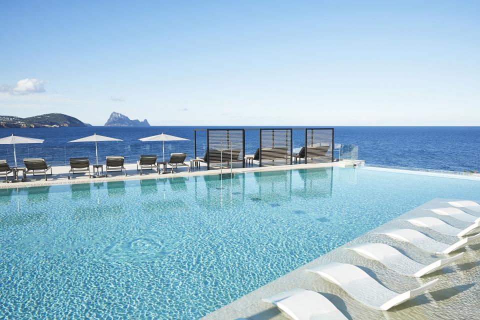 <p>The Balearic Islands are loved by Brits for all kinds of reasons – not least the opportunity they provide for smug, sun-soaked Instagram stories – but the holy grail for hedonists is undoubtedly Ibiza, AKA the White Isle. Fortunately for the 5am crowd, there are countless luxury hotels in Ibiza to soothe sore heads at. </p><p><a class="link " href="https://www.booking.com/luxury/region/es/ibiza.en-gb.html?aid=2200765&label=luxury-ibiza-hotels-button" rel="nofollow noopener" target="_blank" data-ylk="slk:BEST LUXURY HOTELS IN IBIZA;elm:context_link;itc:0;sec:content-canvas">BEST LUXURY HOTELS IN IBIZA</a></p><p>Take <a href="https://www.booking.com/hotel/es/the-standard-ibiza.en-gb.html?aid=2200765&label=luxury-ibiza-hotels-intro" rel="nofollow noopener" target="_blank" data-ylk="slk:The Standard;elm:context_link;itc:0;sec:content-canvas" class="link ">The Standard</a> for example, which arrived this spring and features a 14-room residence that groups can stake out for the party to end all parties. Anyone whose hangover fix is Nikkei food and more sake should book a stay at <a href="https://www.booking.com/hotel/es/oku-ibiza.en-gb.html?aid=2200765&label=luxury-ibiza-hotels-intro" rel="nofollow noopener" target="_blank" data-ylk="slk:Oku;elm:context_link;itc:0;sec:content-canvas" class="link ">Oku</a>, or the <a href="https://www.booking.com/hotel/es/ibiza-bay-resort-spa.en-gb.html?aid=2200765&label=luxury-ibiza-hotels-intro" rel="nofollow noopener" target="_blank" data-ylk="slk:Nobu;elm:context_link;itc:0;sec:content-canvas" class="link ">Nobu</a> outpost in Talamanca, a 15-minute marina-edge walk down from Ibiza Town.</p><p>Because it isn't all about burning the candle at both ends. Away from the San Antonio strip, the island is also famed for its sunset rituals, breezy beach clubs and general good vibes (something to do with <a href="https://www.forbes.com/sites/neloliviawaga/2020/08/19/5-things-you-might-have-not-known-about-ibiza/" rel="nofollow noopener" target="_blank" data-ylk="slk:magnetism, apparently;elm:context_link;itc:0;sec:content-canvas" class="link ">magnetism, apparently</a>). Stroll cobbled streets in the old town, or visit the quieter villages such as Santa Gertrudis, Ibiza’s answer to Notting Hill, and naturally now with fashionable bars and restaurants (check out Bottega Il Buco.)</p><p>For something on the more traditional side, rural <a href="https://www.booking.com/hotel/es/cas-gasi.en-gb.html?aid=2200765&label=luxury-ibiza-hotels-intro" rel="nofollow noopener" target="_blank" data-ylk="slk:Cas Gasi;elm:context_link;itc:0;sec:content-canvas" class="link ">Cas Gasi</a> is the peaceful, celebrity-packed hotel for you – or enjoy the good life (and the bougainvillea) at the <a href="https://www.booking.com/hotel/es/atzaro.en-gb.html?aid=2200765&label=luxury-ibiza-hotels-intro" rel="nofollow noopener" target="_blank" data-ylk="slk:Atzaró;elm:context_link;itc:0;sec:content-canvas" class="link ">Atzaró</a> agriturismo (read: very, very nice farmhouse).</p><p>Read on for the finest luxury hotels in Ibiza…</p>
