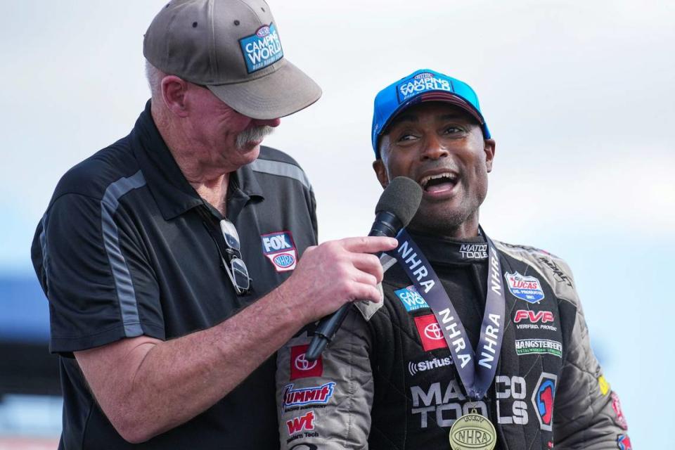 Antron Brown is interviewed after winning his second consecutive NHRA U.S. Nationals Top Fuel title Monday, Sept. 4, 2023, at Lucas Oil Raceway in Brownsburg, Ind. Brown finished in 3.779 seconds, to defeat Steve Torrence.