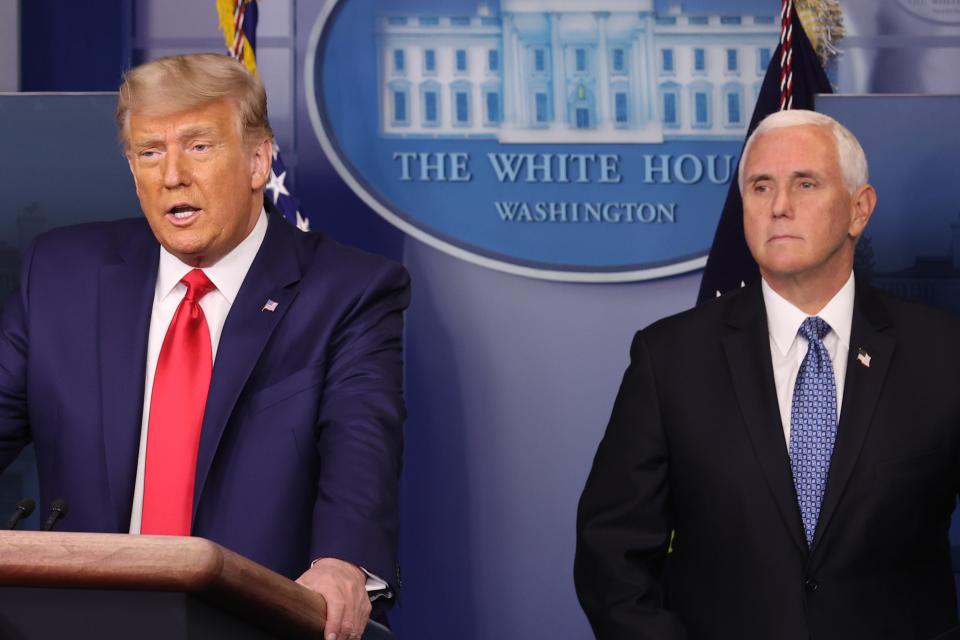 US President Donald Trump (L) speaks as Vice President Mike Pence (R) looks on in the James Brady Press Briefing Room at the White House on 24 November 2020 (Getty Images)