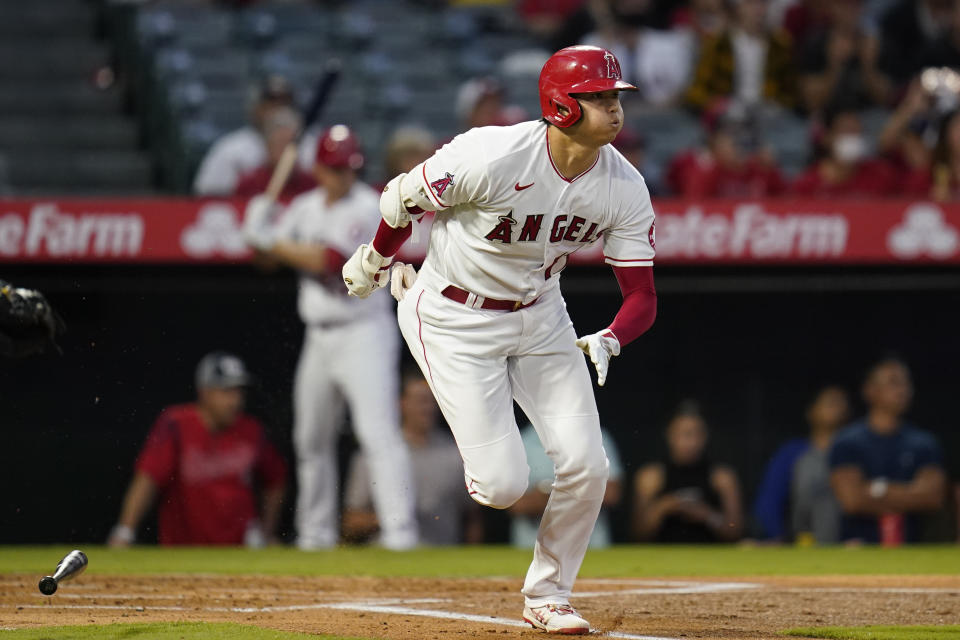 Los Angeles Angels designated hitter Shohei Ohtani (17) runs to first as he singles during the first inning of a baseball game against the Oakland Athletics Friday, Sept. 17, 2021, in Anaheim, Calif. (AP Photo/Ashley Landis)