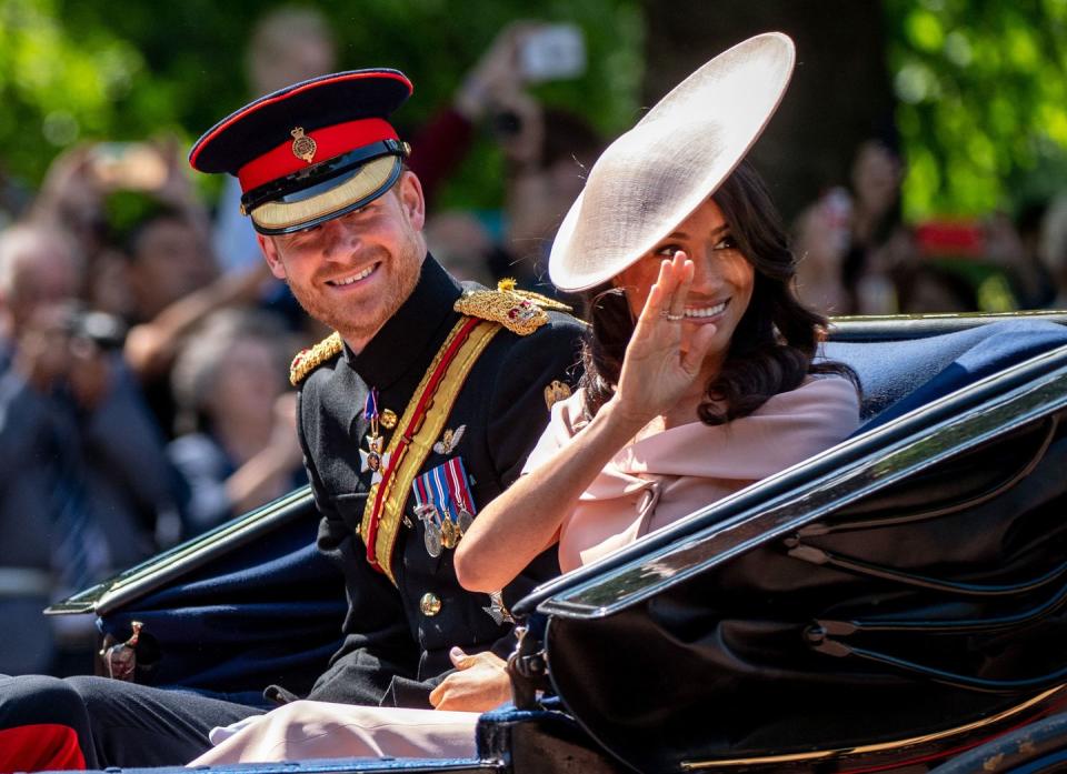<p>She rode in alongside her new husband Prince Harry. (Here's why he doesn't ride on horseback during the parade like his brother.)</p>