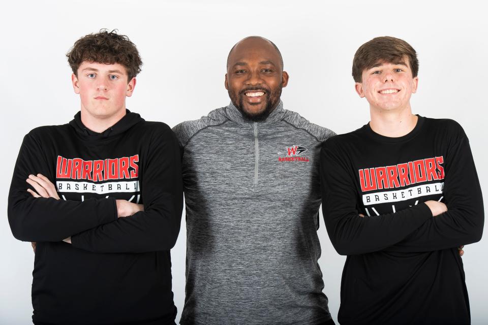 Susquehannock basketball head coach Seth Leonard poses for a photo with seniors Andy Jamison (left) and Cooper Sistrunk (right) during YAIAA winter sports media days Thursday, November 9, 2023, in York.