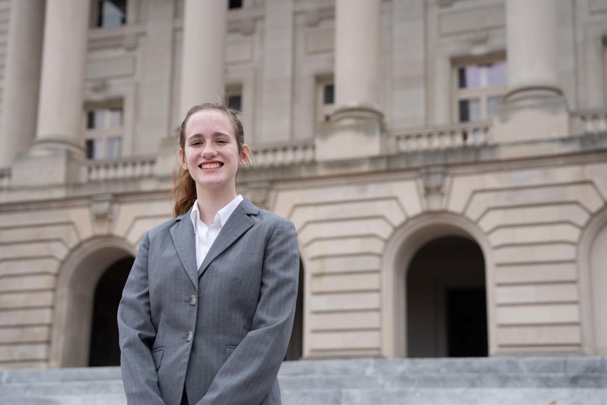 Kiera Dunk poses in front of the Kentucky State Capitol on Thursday, March 14, 2024.