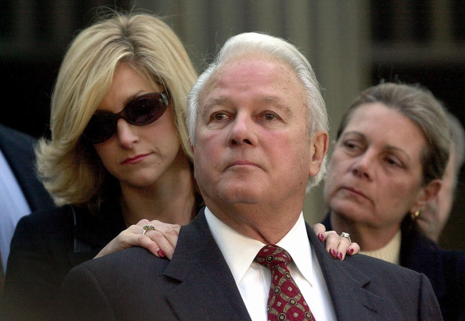 FILE - In this Jan. 8, 2001 file photo, former Louisiana Gov. Edwin Edwards, standing with his wife, Candy, left, and daughter, Anna Edwards, listens to a question from the media, on the steps of the federal courthouse in Baton Rouge, La. Edwards, the high-living four-term governor whose three-decade dominance of Louisiana politics was all but overshadowed by scandal and an eight-year federal prison stretch, died Monday, July 12, 2021, of respiratory problems. He was 93. (AP Photo/Bill Haber, File)