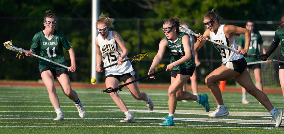 Left to right Charger Laurel McIntosh, Skipper Cameryn Clarke, Charger Megan Ballard and Skipper Emily Kallman sprint for a bouncing ball at mid field during the first half.  