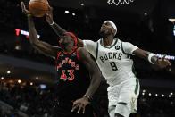 Milwaukee Bucks' Bobby Portis blocks the shot of Toronto Raptors' Pascal Siakam during the first half of an NBA basketball game Saturday, Jan. 15, 2022, in Milwaukee. (AP Photo/Morry Gash)