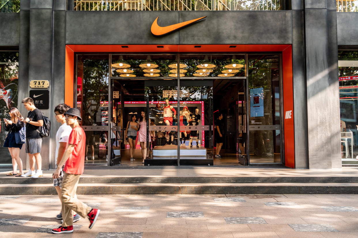 SHANGHAI, CHINA - 2019/09/07: Pedestrians walk past an American multinational sportswear corporation Nike store in Shanghai. (Photo by Alex Tai/SOPA Images/LightRocket via Getty Images)