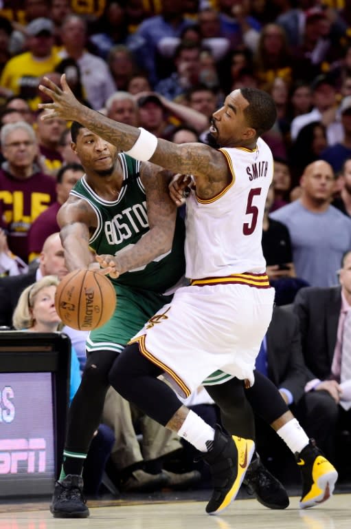 JR Smith of the Cleveland Cavaliers defends against Marcus Smart of the Boston Celtics in Game Three of the 2017 NBA Eastern Conference Finals, at Quicken Loans Arena in Cleveland, Ohio, on May 21