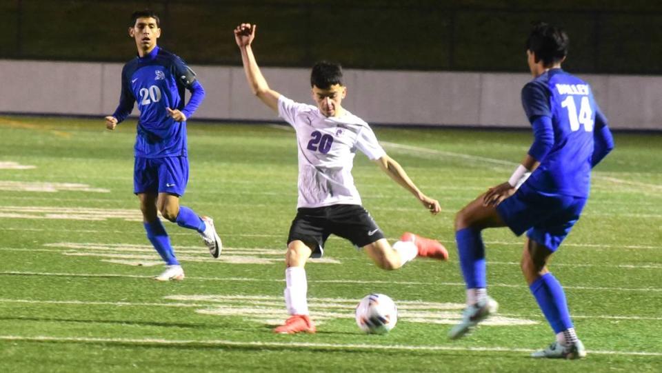 Pacheco High junior Juan Lopez (20) fires a pass against Valley High in the Sac-Joaquin Section Division III championship game at Cosumnes River College in Sacramento on Thursday, Feb. 22, 2024.