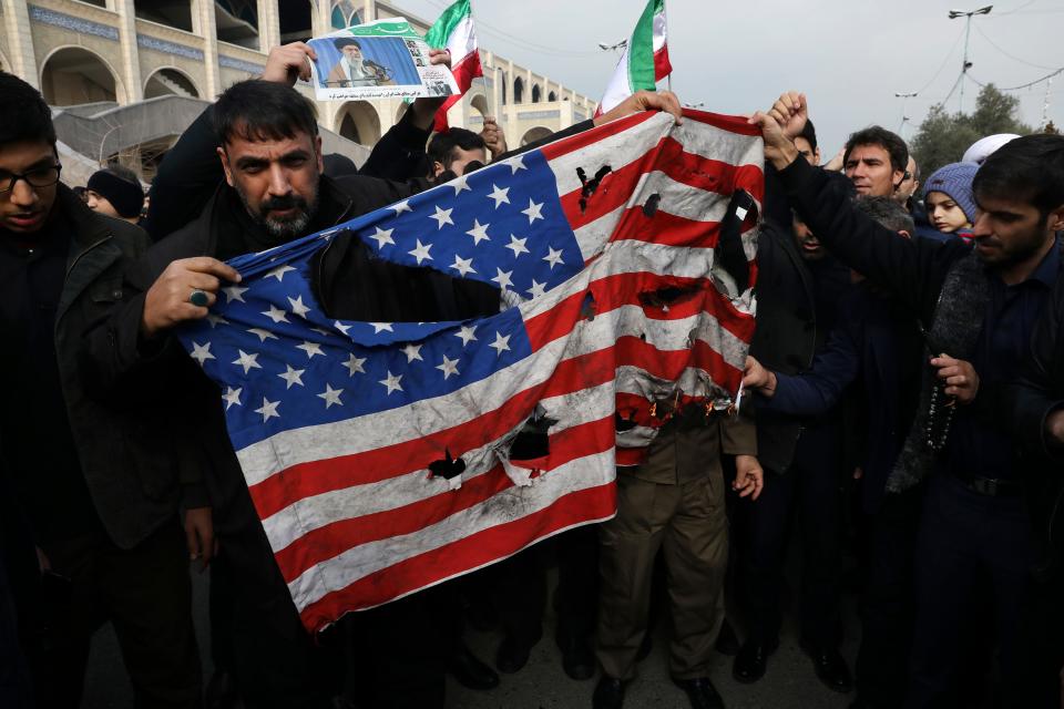 Protesters burn a U.S. flag during a demonstration over the U.S. airstrike in Iraq that killed Iranian Revolutionary Guard Gen. Qassem Soleimani, in Tehran, Iran, Jan. 3, 2020