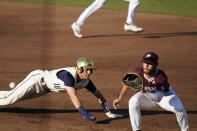 Notre Dame's Jared Miller, left, stretches as he leaps back to first base while Mississippi State first baseman Luke Hancock, right, waits for the throw during an NCAA college baseball super regional game, Monday, June 14, 2021, in Starkville, Miss. (AP Photo/Rogelio V. Solis)