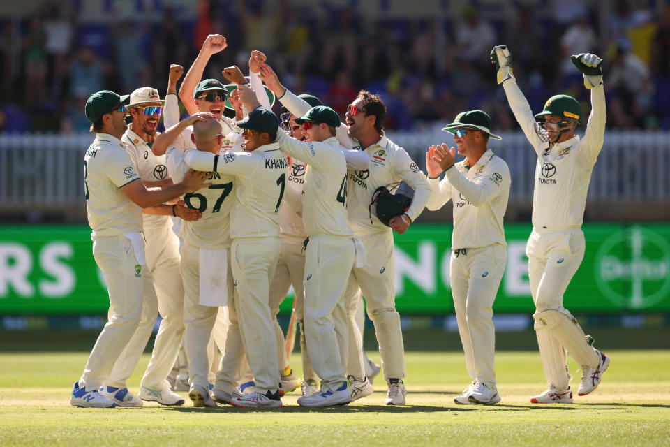 PERTH, AUSTRALIA - DECEMBER 17: Nathan Lyon of Australia and all of the team celebrate Nathan Lyon 500th Test Wicket during day four of the Men's First Test match between Australia and Pakistan at Optus Stadium on December 17, 2023 in Perth, Australia (Photo by James Worsfold - CA/Cricket Australia via Getty Images)