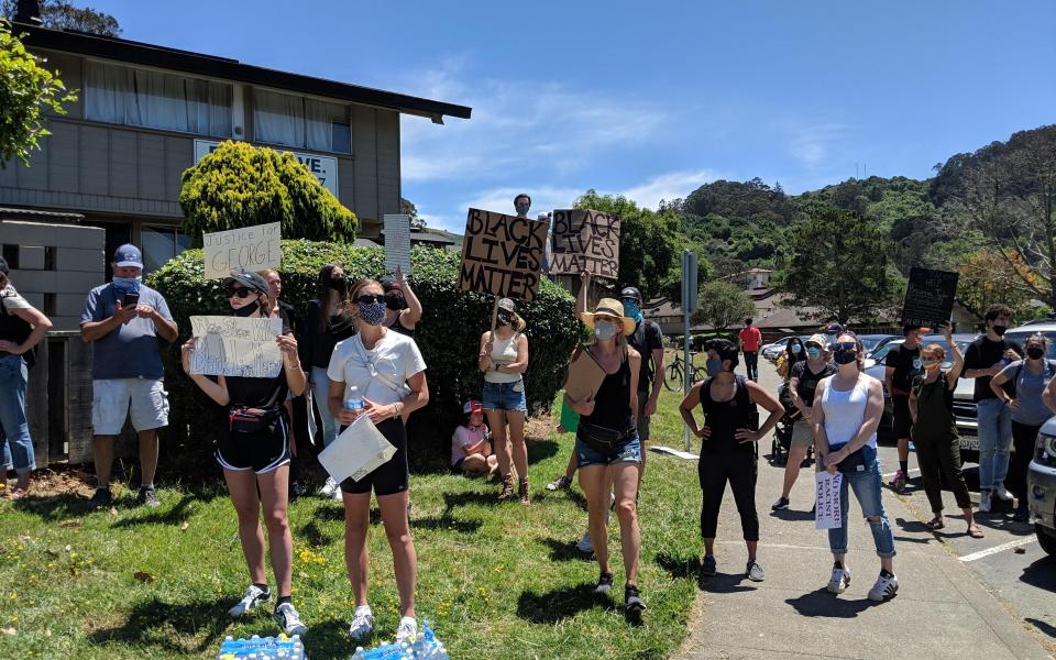 Girls stand in protest of George Floyd's death