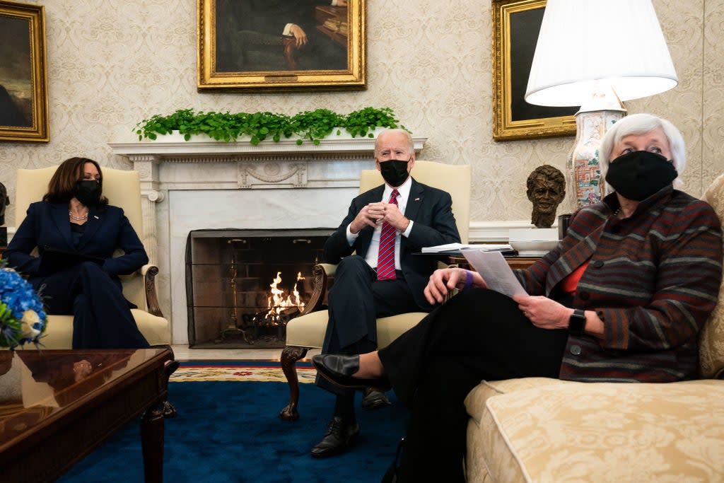 President Joe Biden, middle, meets with Vice President Kamala Harris, left, and Treasury Secretary Janet Yellen about how to move forward amid the coronavirus pandemic. (Getty Images)