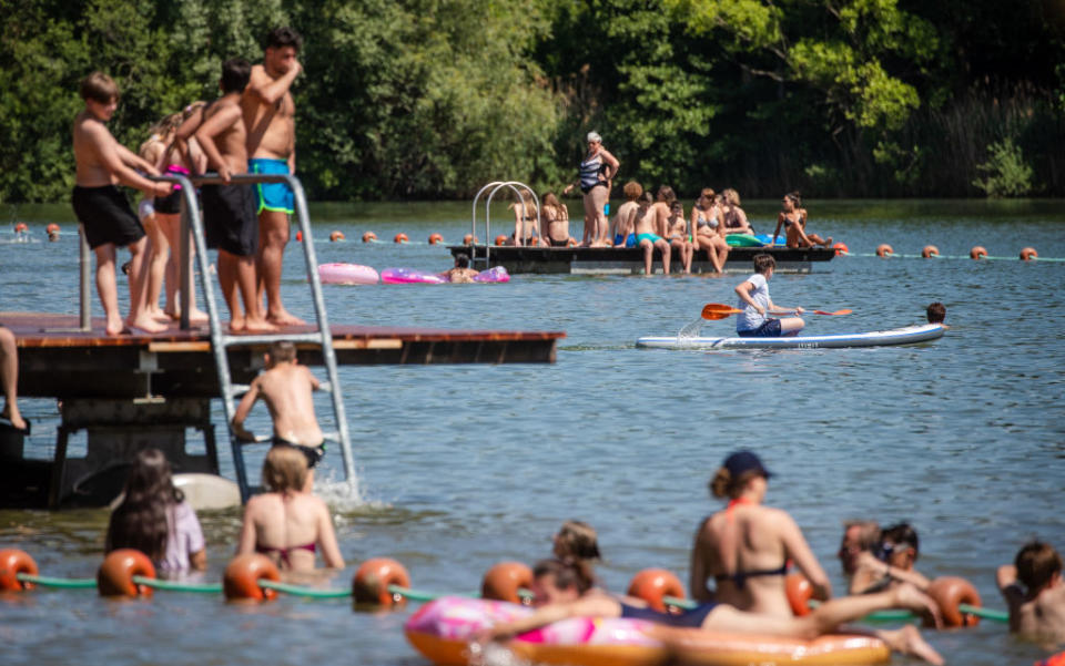 02 June 2020, Baden-Wuerttemberg, PlÃ¼derhausen: People enjoy the sunny day at the bathing lake in PlÃ¼derhausen. Photo: Christoph Schmidt/dpa (Photo by Christoph Schmidt/picture alliance via Getty Images)