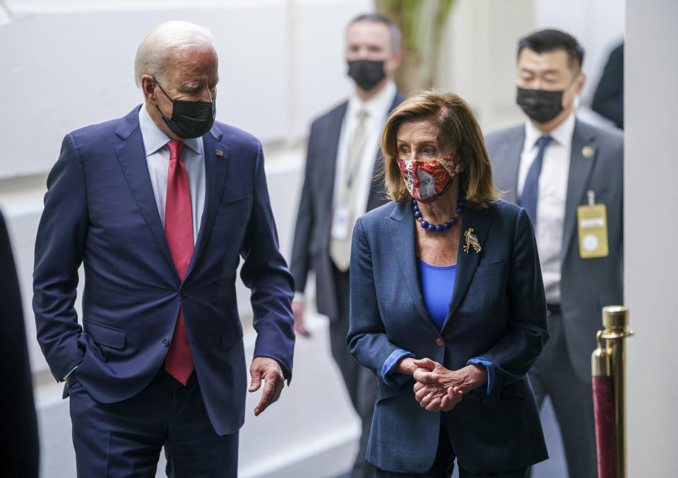 President Joe Biden and Speaker of the House Nancy Pelosi, D-Calif., talk in a basement hallway of the Capitol after meeting with House Democrats to rescue his his $3.5 trillion government overhaul and salvage a related public works bill, in Washington, Friday, Oct. 1, 2021. (AP Photo/J. Scott Applewhite)