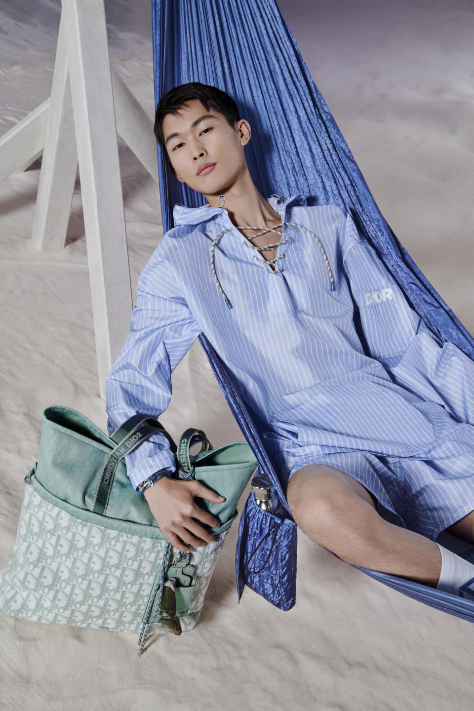 A look from the Dior and Parley for the Oceans' beachwear capsule, and the hammock in collaboration with Latvia-based outdoor hammock specialist Modern Nomad.