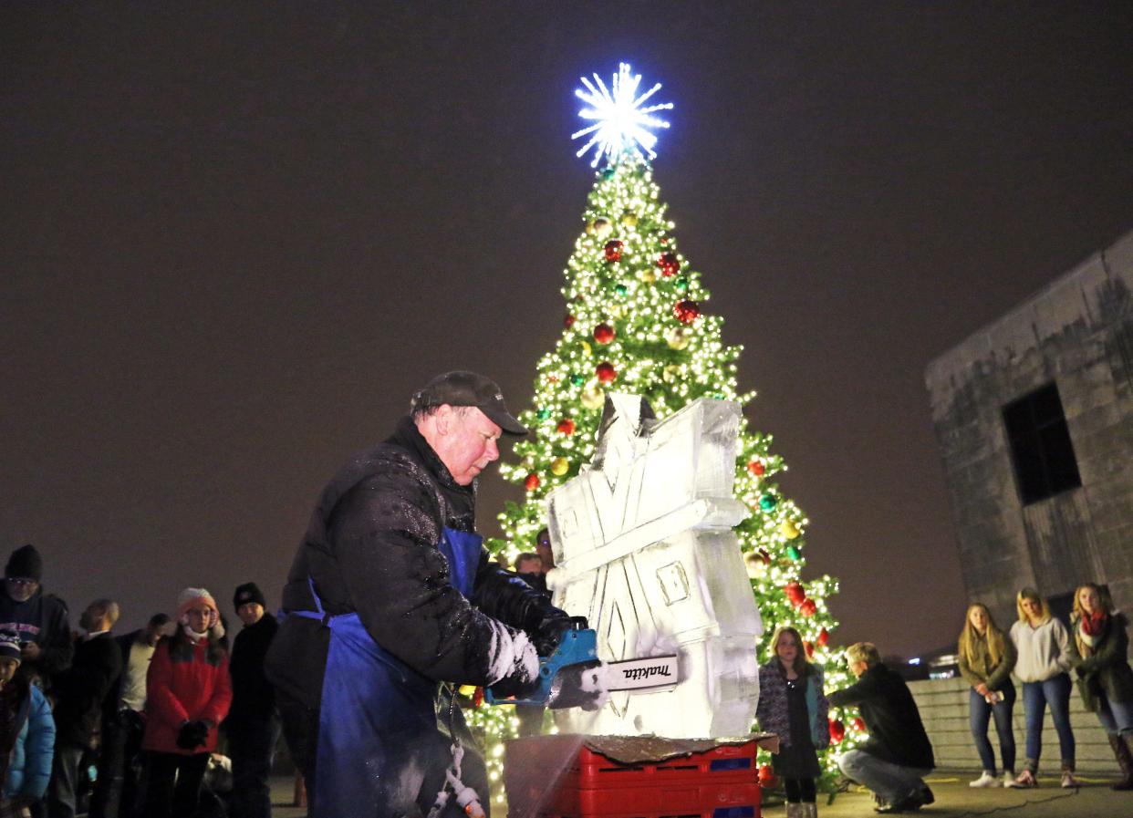 Ice sculptor Bill Gorish creates a masterpiece during the 16th annual Holiday Promenade in the Historic East Village of Des Moines in 2017.