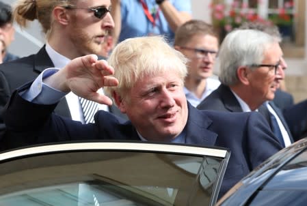 British Prime Minister Boris Johnson waves as he leaves after a meeting with European Commission President Jean-Claude Juncker in Luxembourg