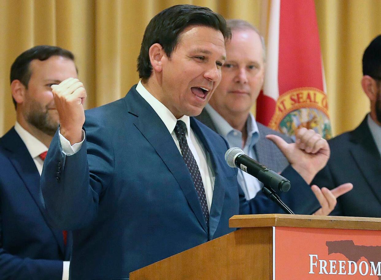 Florida Gov. Ron DeSantis speaks before he signs a record $109.9 billion state budget on June 2.