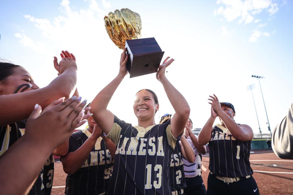 Lamesa's Lexi Hernandez raises the trophy after Lamesa defeats Tulia in Game 2 of the Class 3A area-round softball series, Friday, May 3, 2024, at First United Park in Woodrow.