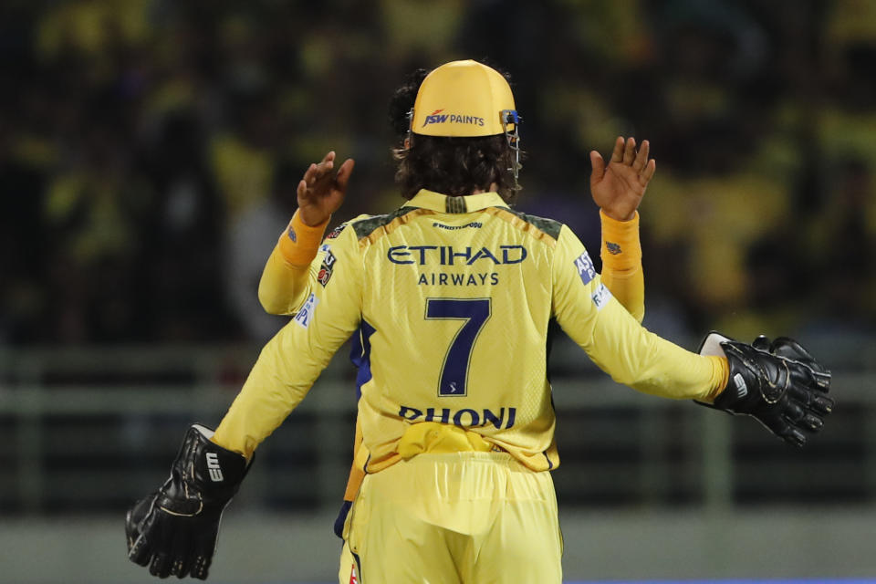 Chennai Super Kings' MS Dhoni celebrates the dismissal of Delhi Capitals' Prithvi Shaw during the Indian Premier League cricket match between Delhi Capitals and Chennai Super Kings in Visakhapatnam, India, Sunday, March. 31, 2024.(AP Photo/ Surjeet Yadav))