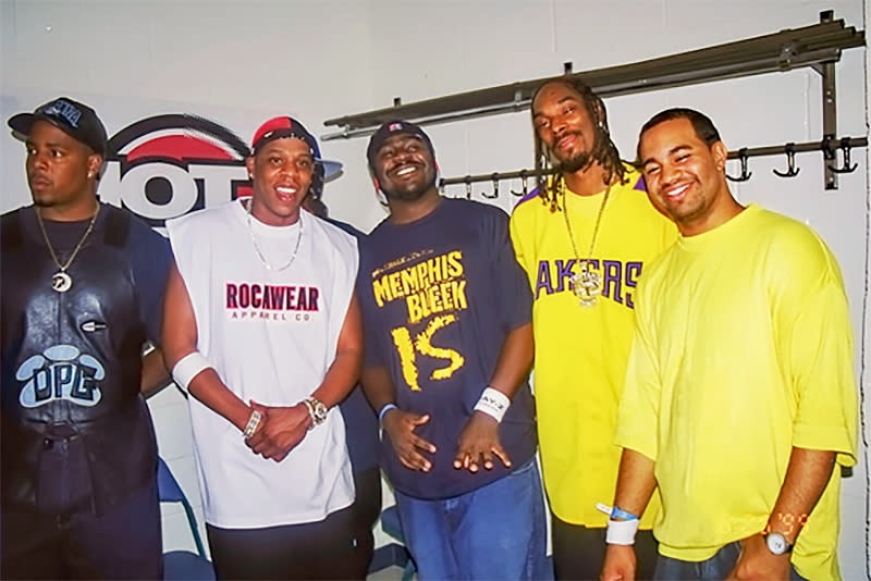 Lenny Santiago, right, hanging out with friends and artists backstage during a Hot 97 Summer Jam concert. (Courtesy Lenny Santiago)