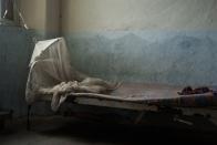 <p>This empty hospital bed appears to still have the mattress imprint of the last person who sleep on it. <br></p>