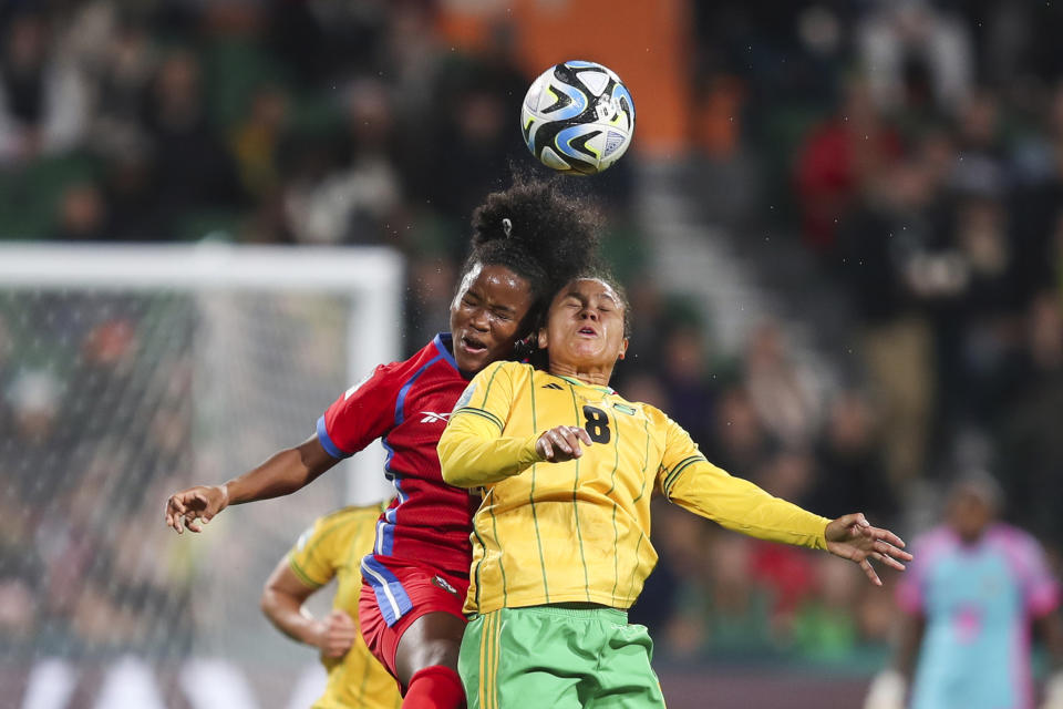 Jamaica's Drew Spence, right, goes for a header with Panama's Deysire Salazar during the Women's World Cup Group F soccer match between Panama and Jamaica in Perth, Australia, Saturday, July 29, 2023. Jamaica won 1-0. (AP Photo/Gary Day)