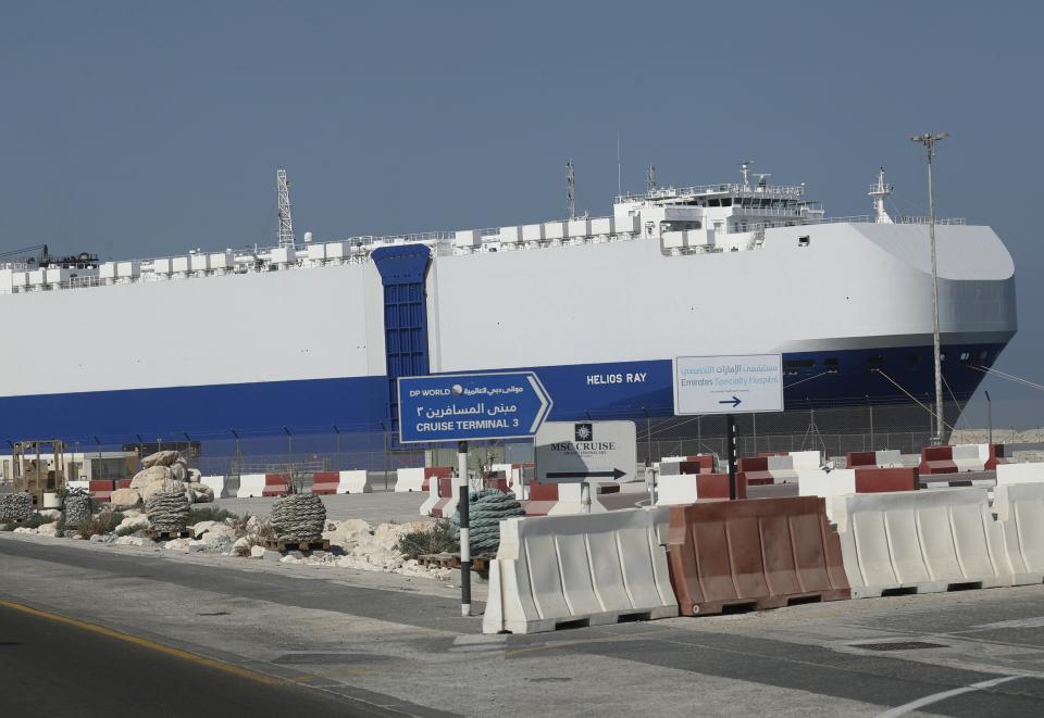 The Israeli-owned cargo ship, Helios Ray, sits docked in port after arriving earlier in Dubai, United Arab Emirates, Sunday, Feb. 28, 2021. The ship has been damaged by an unexplained blast at the gulf of Oman on Thursday. (AP Photo/Kamran Jebreili)