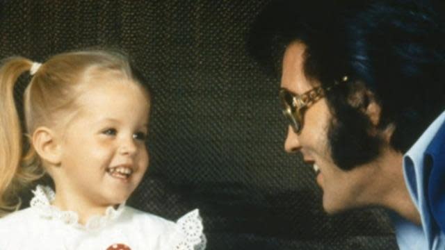 A young Lisa Marie with her father, Elvis. She will be buried on the grounds of her late father's former home, Graceland. 