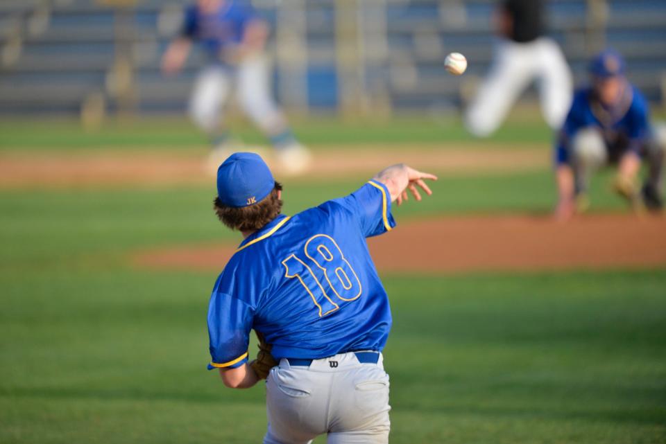 Cathedral's Grant Wensmann throw the ball across the diamond to first base against Pierz on Friday, May 21, 2021, at Joe Faber Field at the MAC. 