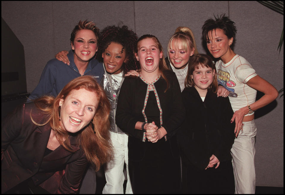 LONDON - DECEMBER 15: (Clockwise bottom L to R) The Duchess of York, Sarah Ferguson, Melanie Chisholm, Melanie Brown, Princess Eugenie, Emma Bunton, Princess Beatrice, and Victoria Adams pose backstage at the Spice Girls concert held at Earls Court in London on December 15, 1999. (Photo by Dave Hogan/Getty Images)