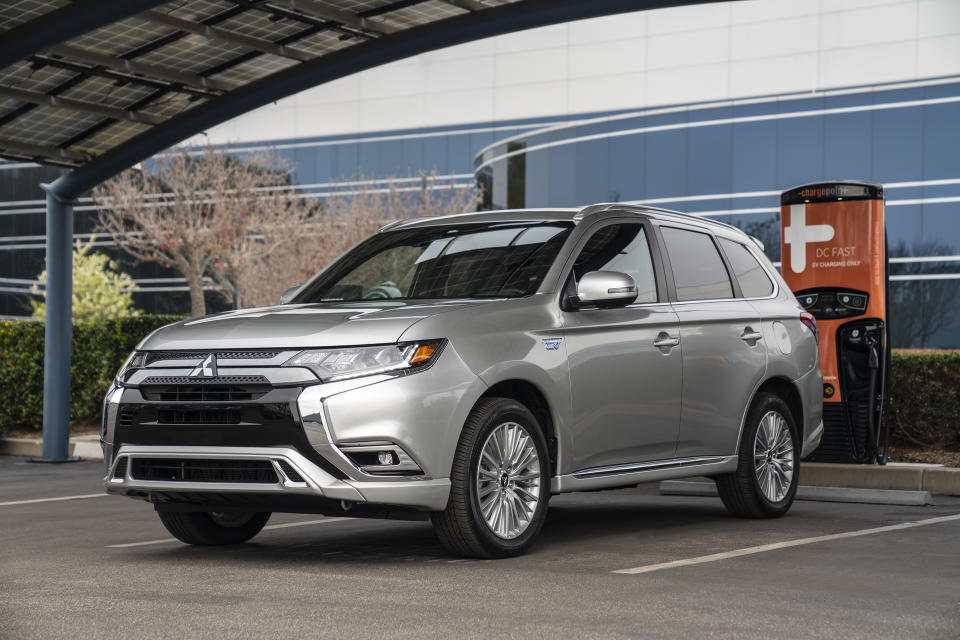 This photo provided by Mitsubishi shows a 2019 Outlander PHEV. This version of the Outlander SUV has a plug-in hybrid powertrain that can go an EPA-estimated 22 miles on all-electric power. (David Dewhurst/Mitsubishi Motors via AP)